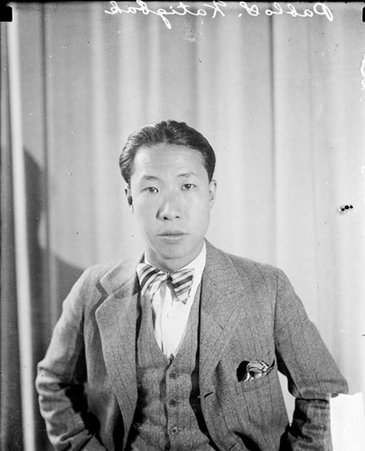 Pablo S. Katigbak looking toward the camera, sitting in front of a light-colored backdrop in a room - Chicago Daily News, Inc.