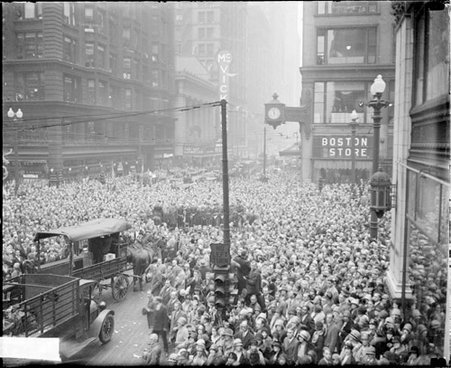 Crowds celebrating Armistice Day, standing on State and Madison Streets, dark exposure - Chicago Daily News, Inc.