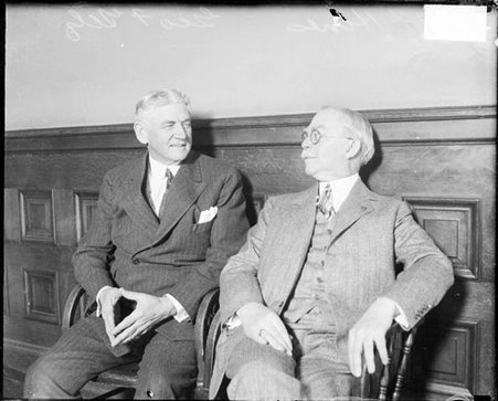 Edward Hines and George Getz looking at one another, sitting in a room, light exposure - Chicago Daily News, Inc.