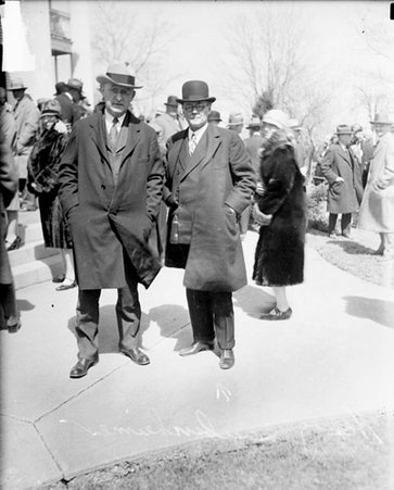 Harry C. W. Laubenheimer standing with an unidentified man in front of a building - Chicago Daily News, Inc.