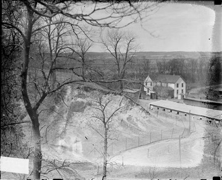 Two buildings at the foot of Swallow Cliff in Palos Park, Illinois - Chicago Daily News, Inc.