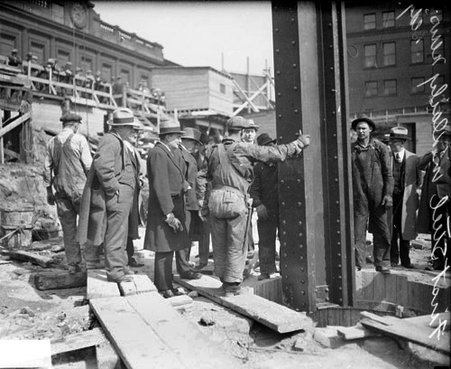 Construction worker standing with his back to the camera at the construction site of the new Chicago Daily News building - Chicago Daily News, Inc.