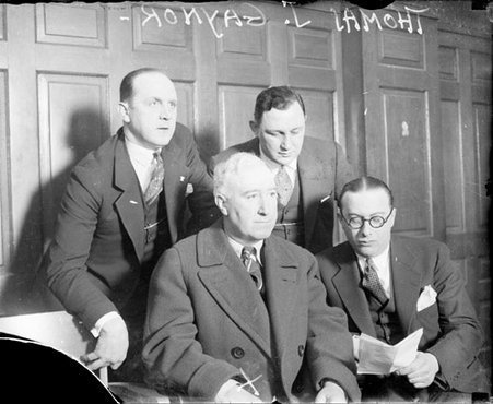 Thomas J. Gaynor sitting with three unidentified men in a room - Chicago Daily News, Inc.