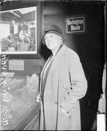 Miss Daisy Oden looking toward the camera, standing in a room - Chicago Daily News, Inc.
