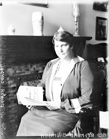 Mrs. Reimund Baumann looking to the right of the camera, sitting in a room - Chicago Daily News, Inc.