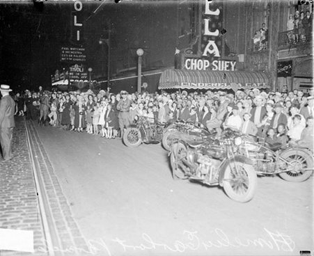 Crowds standing on the street near 63rd Street and Cottage Grove Avenue during a parade for Amelia Earhart - Chicago Daily News, Inc.