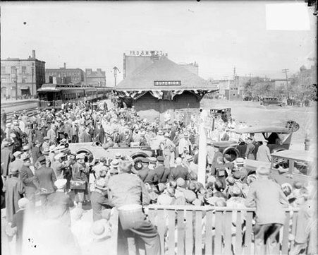Crowds standing at a railroad stop in Brule, Wisconsin, during the arrival of Calvin Coolidge - Chicago Daily News, Inc.