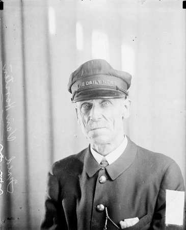 Fred Van Horston looking toward the camera, wearing a cap, sitting in a room - Chicago Daily News, Inc.