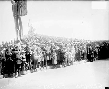 Crowds standing along a sidewalk during a parade for the Bremen Flyers - Chicago Daily News, Inc.