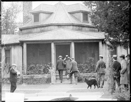 President and Mrs. Calvin Coolidge walking up the front steps to their summer home - Chicago Daily News, Inc.
