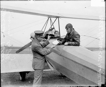 Captain P. A. Wheeler standing next to an airplane during flying lessons - Chicago Daily News, Inc.