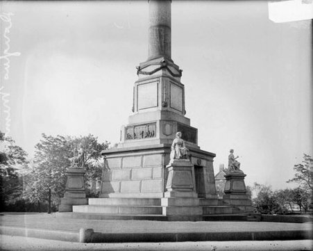 Three statues located at three corners of a monument to Stephen A. Douglas in Douglas Monument Park - Chicago Daily News, Inc.