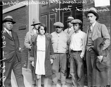 Ranieri case, Antoinette, Andrew, and Anthony Cappellano standing with four unidentified men in front of a building - Chicago Daily News, Inc.