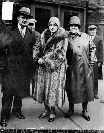 Mrs. Lorraine Irwin DeFranco, who was involved in the trial of Dr. Amante Rongetti, standing on sidewalk - Chicago Daily News, Inc.