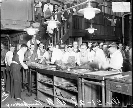 Men wearing work clothes and suits standing in the Chicago Daily News composing room - Chicago Daily News, Inc.