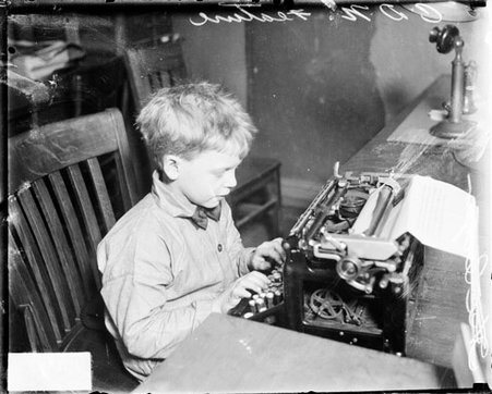 Boy typing on a typewriter at Chicago Daily News sanitarium - Chicago Daily News, Inc.