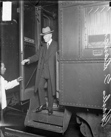 Charles G. Dawes, Vice President, stepping off passenger train - Chicago Daily News, Inc.