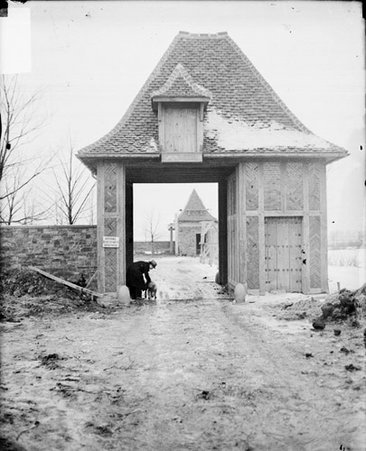 New home of Lieut. Noble B. Judah, Jr., Fire Department, with man in doorway - Chicago Daily News, Inc.