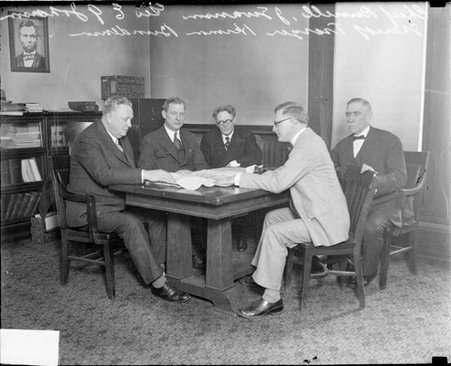 Law enforcement officials, including Capt. William F. Russell, George E. Johnson, and Sheriff John E. Traeger - Chicago Daily News, Inc.