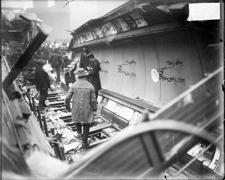 Chicago & Northwestern Railway train wreck with men standing amid wreckage - Chicago Daily News, Inc.