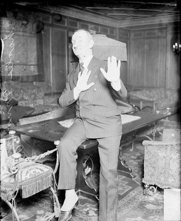 Charles Murray, movie actor, holding up his hands - Chicago Daily News, Inc.