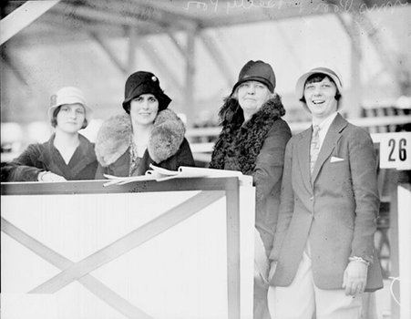 Mrs. Fred A Poor with daughter, sitting in box seats at the South Shore Country - Chicago Daily News, Inc.