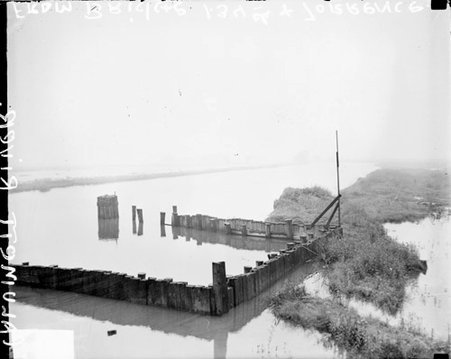 Wooden frame sticking out of flooded Calumet River at Burnham, Illinois - Chicago Daily News, Inc.