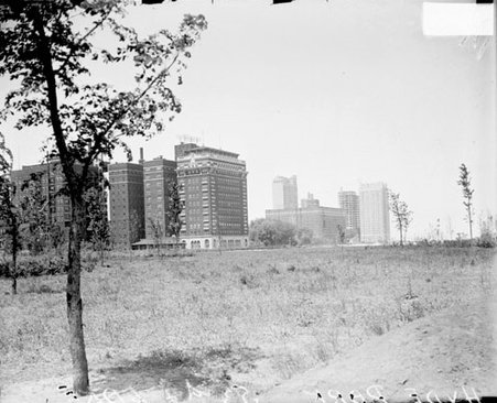 Intersection of 53rd and Lake Park Streets, viewed from across a field - Chicago Daily News, Inc.