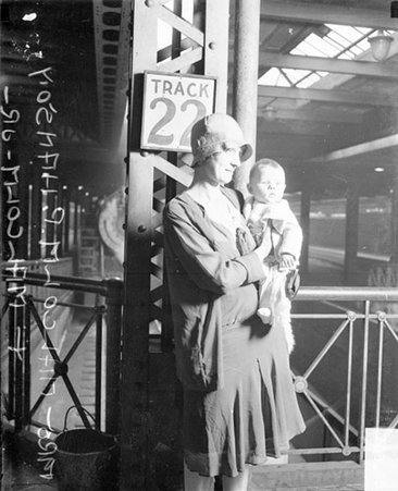 Mrs. Malcolm P. Hanson and son on a train platform - Chicago Daily News, Inc.