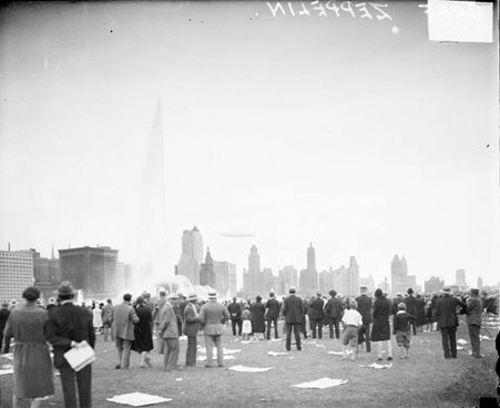 Graf Zeppelin flying over the Chicago skyline, dark exposure - Chicago Daily News, Inc.