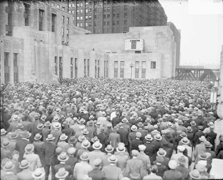 Crowds standing in the plaza of the new Chicago Daily News building, dark exposure - Chicago Daily News, Inc.