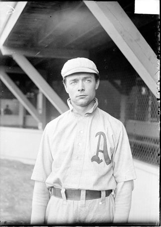 Baseball player, Harry Davis of the Philadelphia Athletics standing by grandstand concourse, Southside Park - Chicago Daily News, Inc.