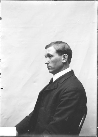 Baseball player, Alex Hardy, Chicago Orphans, in profile, sitting against a plain backdrop - Chicago Daily News, Inc.