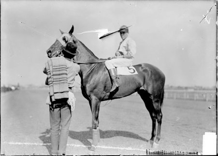 Racehorse, By Ways, with jockey mounted and handler attending, standing on the track, Washington Park Race Track - Chicago Daily News, Inc.