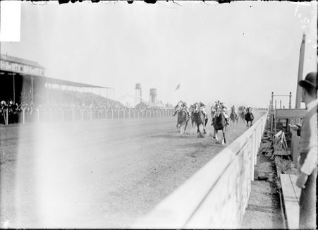 Hawthorne Race Track, one racehorse pulling ahead of other racehorses on track - Chicago Daily News, Inc.