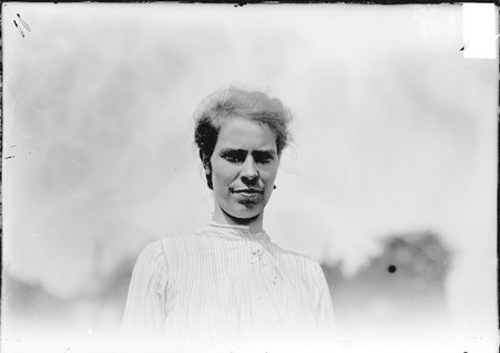 Tennis player, Myrtle McAteer, standing outdoors - Chicago Daily News, Inc.