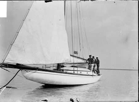 Yacht, Pilot, moored on Lake Michigan with three crew members standing on deck - Chicago Daily News, Inc.