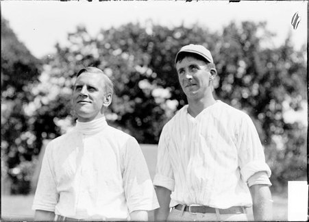 Golfers, M. Paul Noyes and Trigg Waller, standing on grounds of Esmoor Golf Club - Chicago Daily News, Inc.