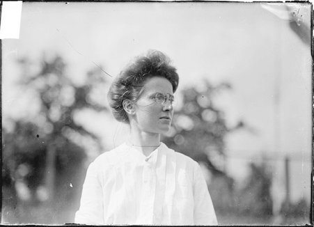 Tennis player, Grace Kingsbury, standing outdoors - Chicago Daily News, Inc.