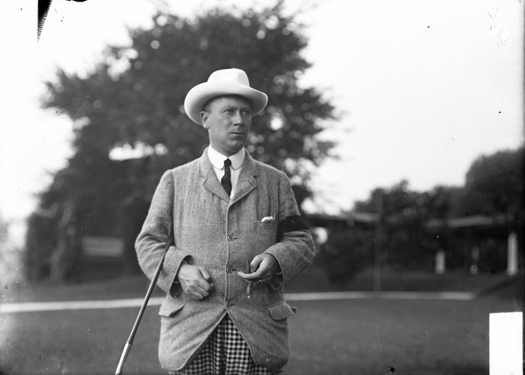 Golfer, Captain Low, standing with golf club resting against his arm - Chicago Daily News, Inc.