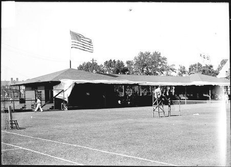 Tennis club, pavilion with tennis courts and an official - Chicago Daily News, Inc.
