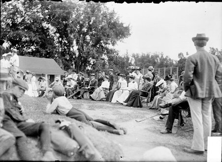 Exmoor Golf Club, group of spectators and caddies sitting outdoors in chairs on the grass - Chicago Daily News, Inc.