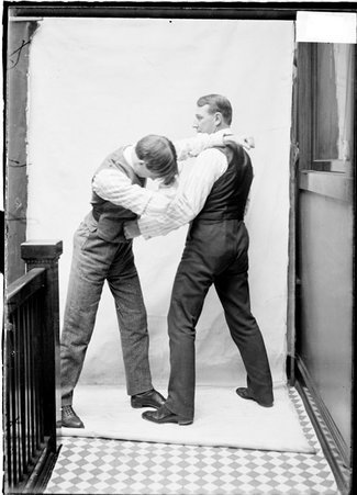 Pugilist, Tommy Ryan, unidentified man throwing a straight past Ryan's face, Daily News hallway - Chicago Daily News, Inc.