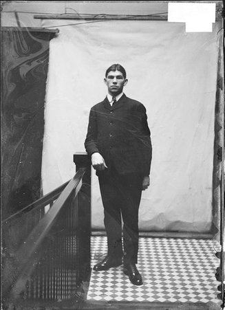 Pugilist, Martin Canole, standing in Chicago Daily News hallway - Chicago Daily News, Inc.