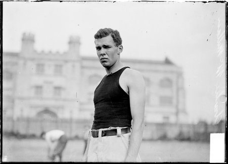 Football player, C. McMillian, University of Chicago, standing on Marshall Field - Chicago Daily News, Inc.