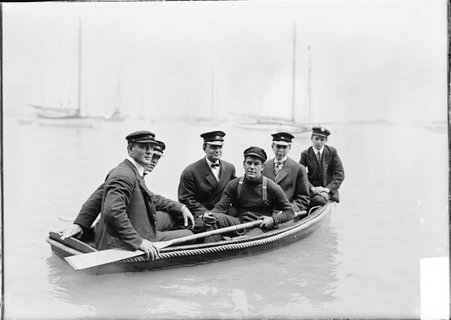 Yachtsmen, crew of the La Rita, six men, sitting in rowboat, looking over stern, Lake Michigan - Chicago Daily News, Inc.