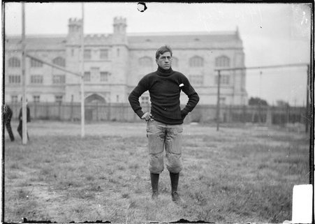Football player, Walter Eckershall, University of Chicago, standing on Marshall Field near goal post - Chicago Daily News, Inc.