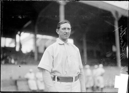 Baseball player, Jack McCarthy, Chicago Cubs, standing in foul area near grandstand West Side Grounds - Chicago Daily News, Inc.