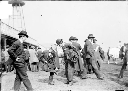 Horseman, Charles H. Smith, and other horsemen standing in paddock at Worth Race Track - Chicago Daily News, Inc.