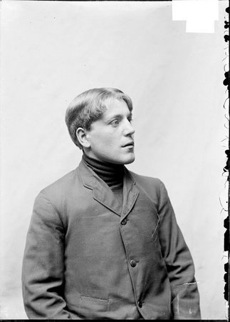 Chess player, J. Eppen, looking left, sitting in front of a light colored backdrop - Chicago Daily News, Inc.